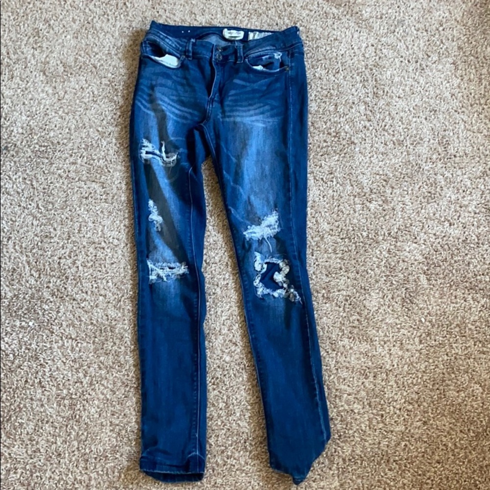 I am selling dark blue ripped jeans.